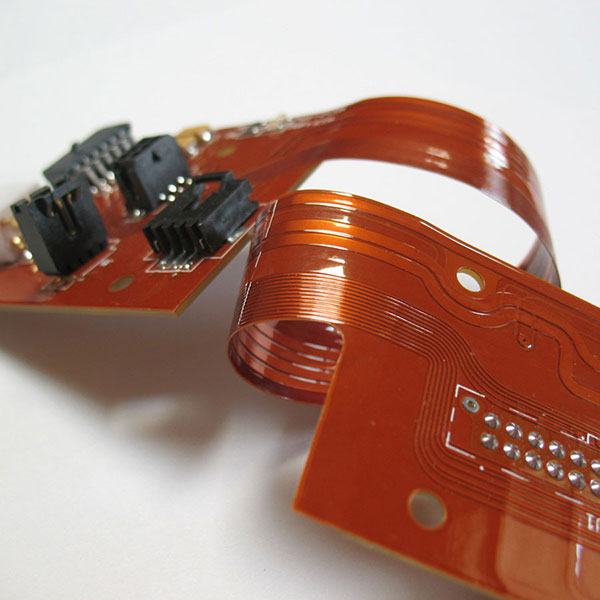 Flexible copper circuit sections connecting rigid areas of a rigid-flex PCB