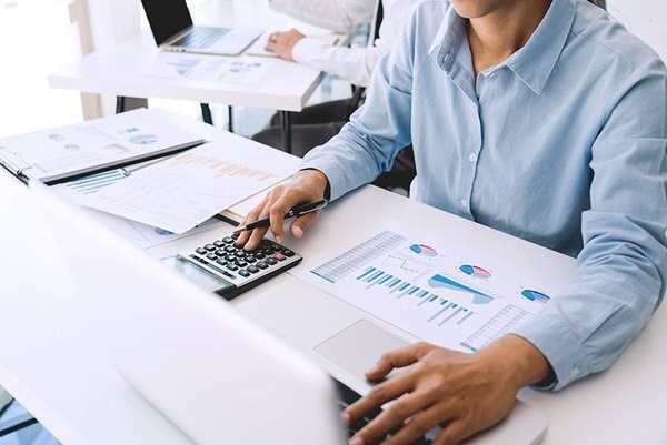 Procurement professional comparing PCB assembly supplier quotations and project costs